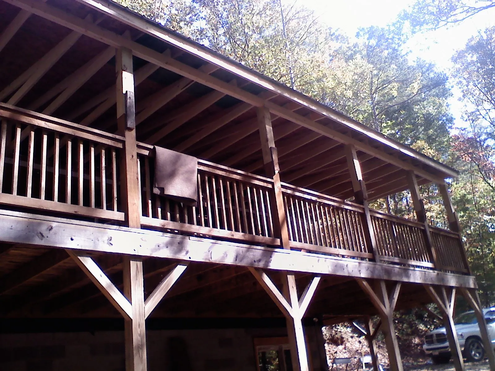 Timber framing under a new elevated porch and deck — Roof Leak Repair in North Conway by Roofing Brothers